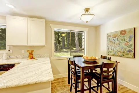 Dining area in bright kitchen room Stock Photos