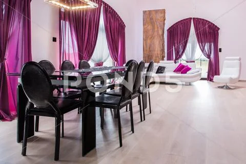 Dining area with dark table Stock Photos