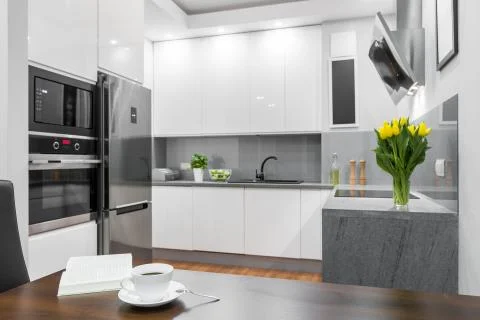 Dining area open to a kitchen idea Stock Photos