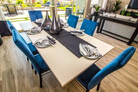 Dining Area With Rectangular Table &amp; Six High Back Blue Chairs Stock Photos