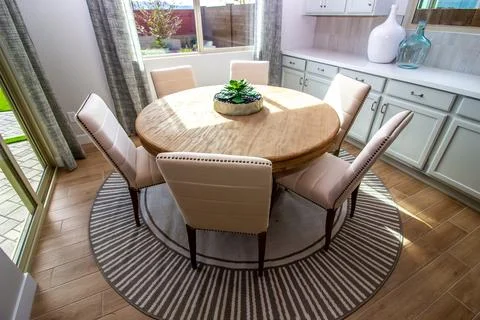 Dining Area With Round Table And Six High Back Chairs Stock Photos
