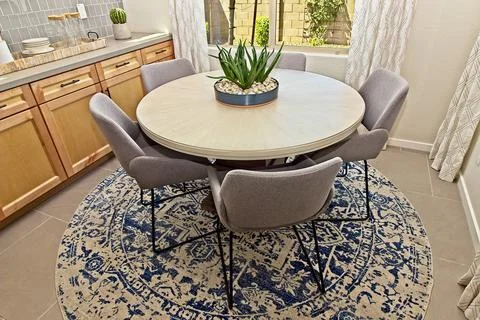Dining Area Round Table With Five Chairs Stock Photos
