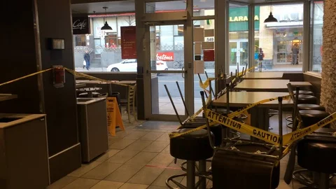 Dining area taped off and closed inside Toronto restaurant Stock Footage 127851555