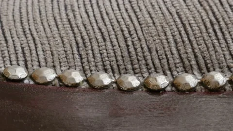 Dining chair striped fabrics texture and tacks 4k panning video Stock Footage 96734598