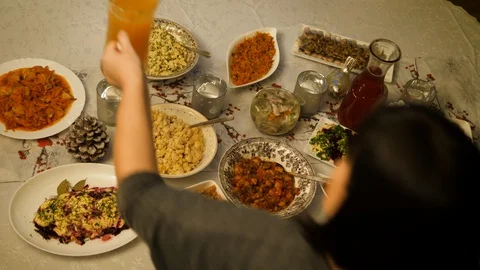 Dining Christmas table preparing dinner. Woman Serving homemade food family home Stockbeeldmateriaal 129041529
