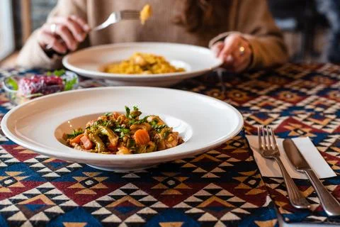 Dining with Colorful Dishes on Patterned Tablecloth Stock Photos