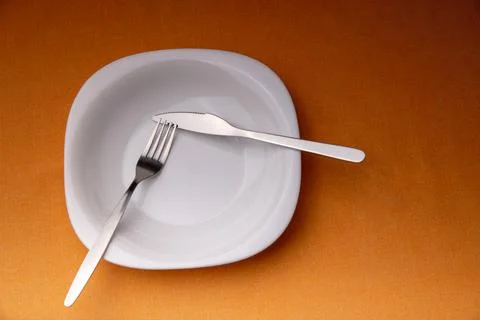 Dining etiquette - I still eat, pause. Fork and knife signals with location o Stock Photos