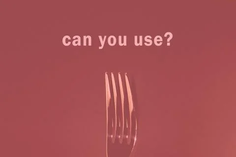 Dining fork on a colored background Stock Photos
