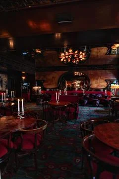 Dining hall interior with red chairs at Maxims Paris restaurant 17 July 2025 Foto stock