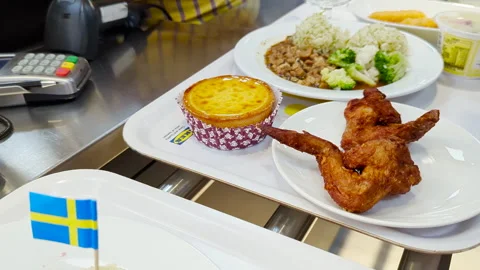 Dining at IKEA: Tray of Delights at the Checkout Counter Stock Footage 293471141