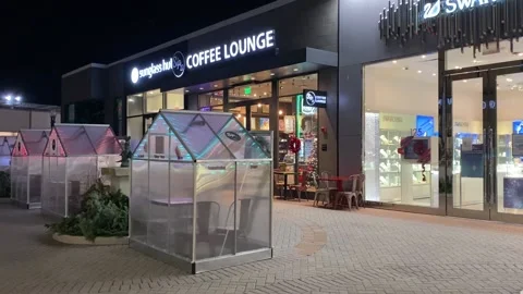 Dining pods in front of coffee lounge Stock Footage 144380954