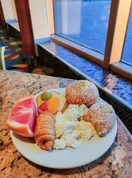 Dining Room Buffet aboard the abstract luxury cruise ship. Healthy breakfast at Stock Photos