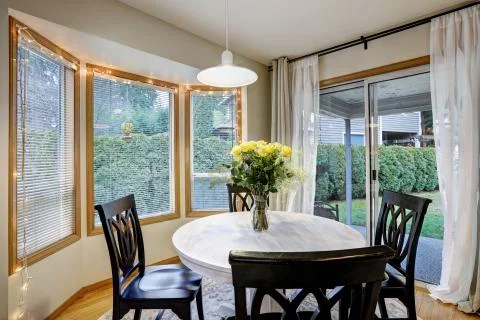 Dining room with curved window wall  Stock Photos