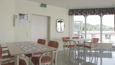 Dining Room With Laid Tables and Chairs, Large Windows, Static Wide Shot Vídeo Stock 341519035