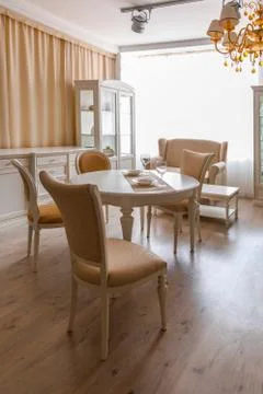 Dining room in light tones with table and chairs Stock Photos