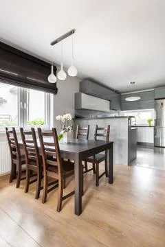 Dining room open to a kitchen idea Stock Photos