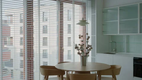 Dining room table with chairs inside empty kitchen interior apartment property Stock Footage 335540908
