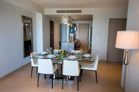 Dining room with a table for dinner with fruit. Stock Photos