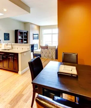 Dining room table with kitchen. Stock Photos
