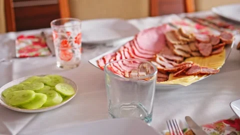 Dining Room Table Prepared with Tasty Food Salad and Tableware for Family Dinner Stock Footage 267266493