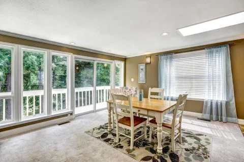 Dining room with walkout deck Stock Photos