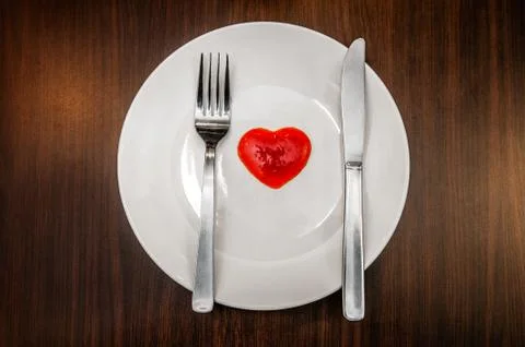 Dining Set With Red Heart Shaped Sauce On White Plate Stock Photos