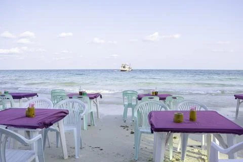 Dining setup table with a stunning sea beach view Stock Photos