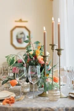A dining table and comfortable armchairs in a modern house with a light dining Stock Photos