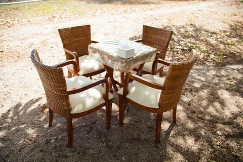 Dining table and umbrella. Stock Photos