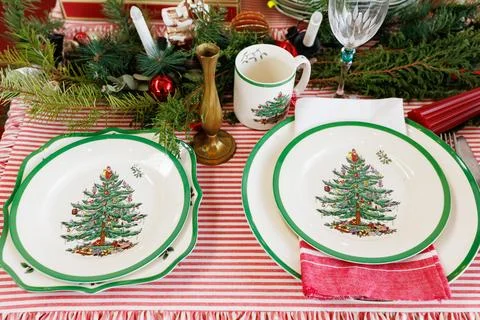 Dining table with beautiful setting for Christmas celebration in festive room Stock Photos