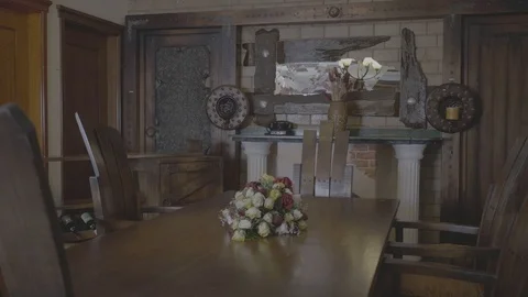 Dining table, a box aside,a mirror and candle stics infront. Stock Footage 97226844