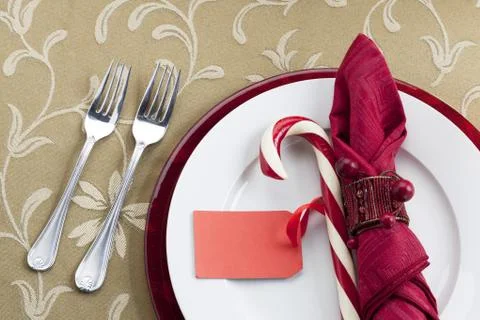 Dining table with candy cane and forks Stock Photos