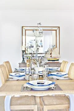 Dining table with ceramics also glasses. Stock Photos