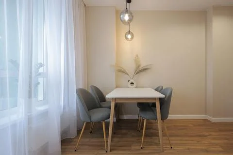 Dining table with chairs in the kitchen interior Foto stock