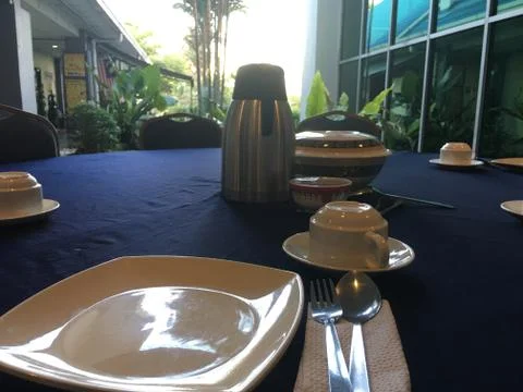 Dining table complete with lunch equipment Stock Photos