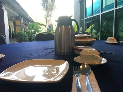 Dining table complete with lunch equipment. Stock Photos