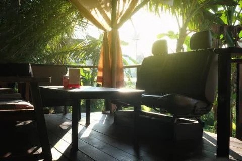Dining table corner in garden house with nature background in the morning Fotos Stock