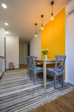 Dining table in cozy well designed dining room Stock Photos