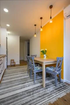 Dining table in cozy well designed dining room Stock Photos