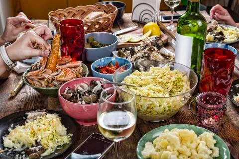 Dining table. differently-sized snacks, celebration Family dinner variety of  Stock-Fotos