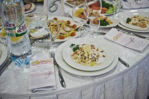 Dining table with dishes 4184. Stock Photos