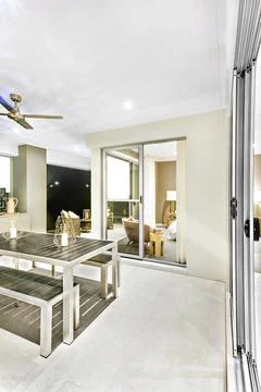 Dining table with a glass door opened at night Stock Photos