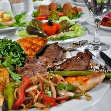 Dining table grilled lamb chop steak kebab in luxury restaurant, Turkish kebab Stock Photos