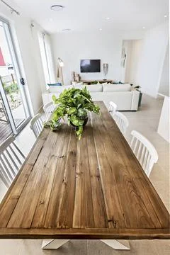Dining table including chairs and vase Stock Photos