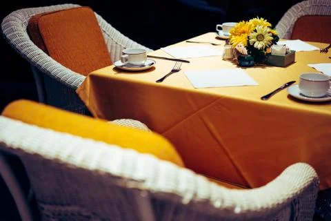 Dining table laid bare in the elegant restaurant. Stock Photos