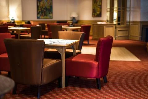 Dining table laid bare in the elegant restaurant. Stock Photos