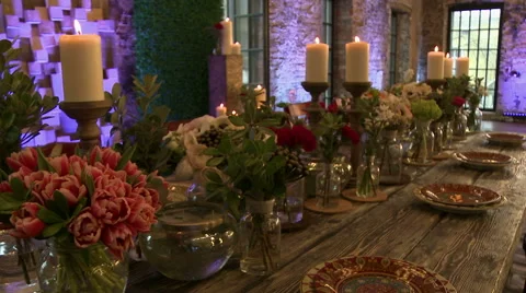 Dining table lavishly decorated with fresh flowers Stock Footage 44021417