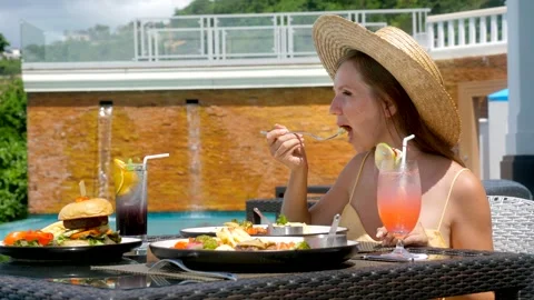 Dining table luxury hotel beach club, attractive woman eating lunch, breakfast Video stock 179053865