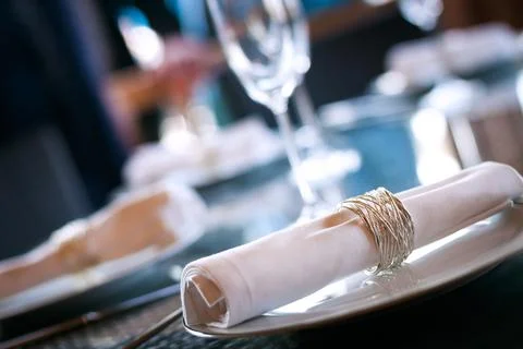 Dining table meal setting in restaurant with napkin ring for food and drink. 스톡 사진