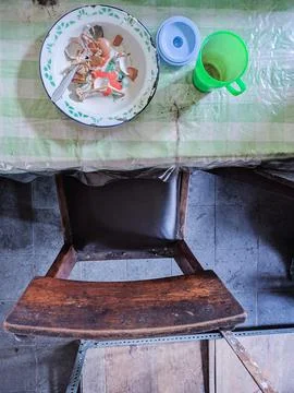 The dining table is in a mess. A messy dining table with used dishes and full Stock Photos